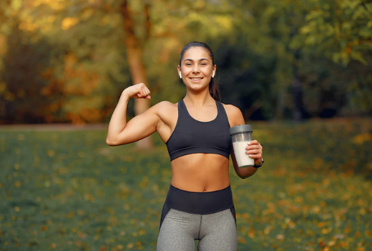 Girl having protein powder to keep herself fit.